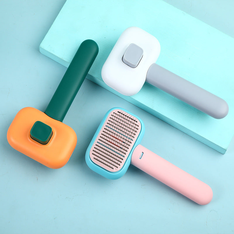 Pet Grooming Massage Brush with stainless steel pins for removing loose hair, tangles, and knots from cats and dogs while providing a gentle massage