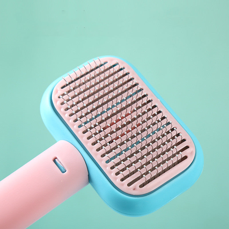 Pet Grooming Massage Brush with stainless steel pins for removing loose hair, tangles, and knots from cats and dogs while providing a gentle massage