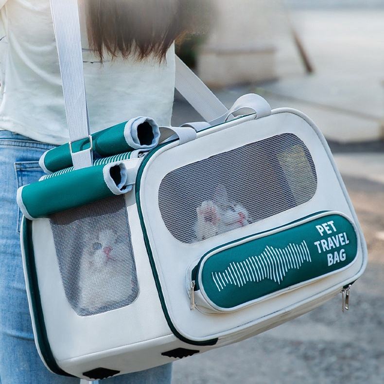 Soft Sided Pet Travel Carrier with breathable mesh panels, foldable design, shoulder strap, and secure zipper for cats and small dogs